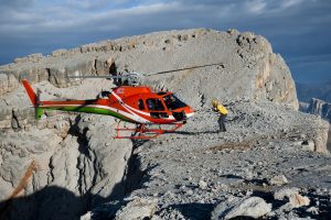 helicopter landing in dolomites